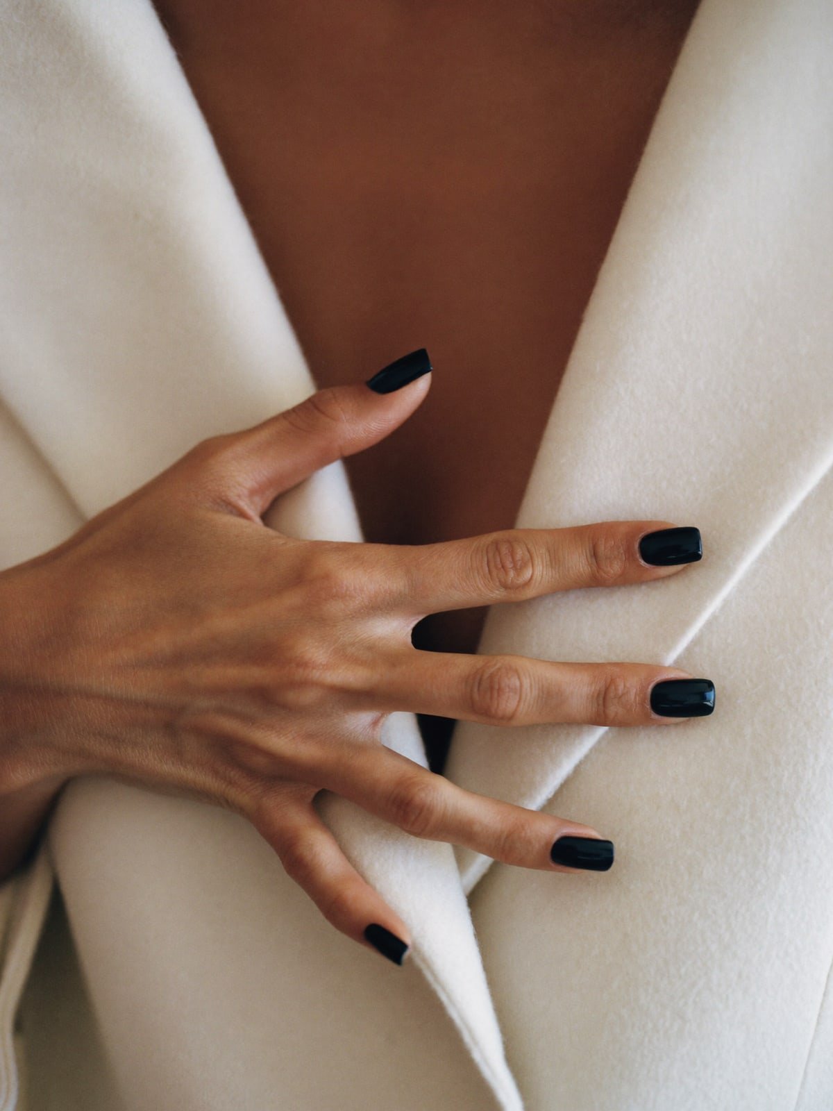 Ink press-on nails worn on hand — Short square · Jet-black gloss