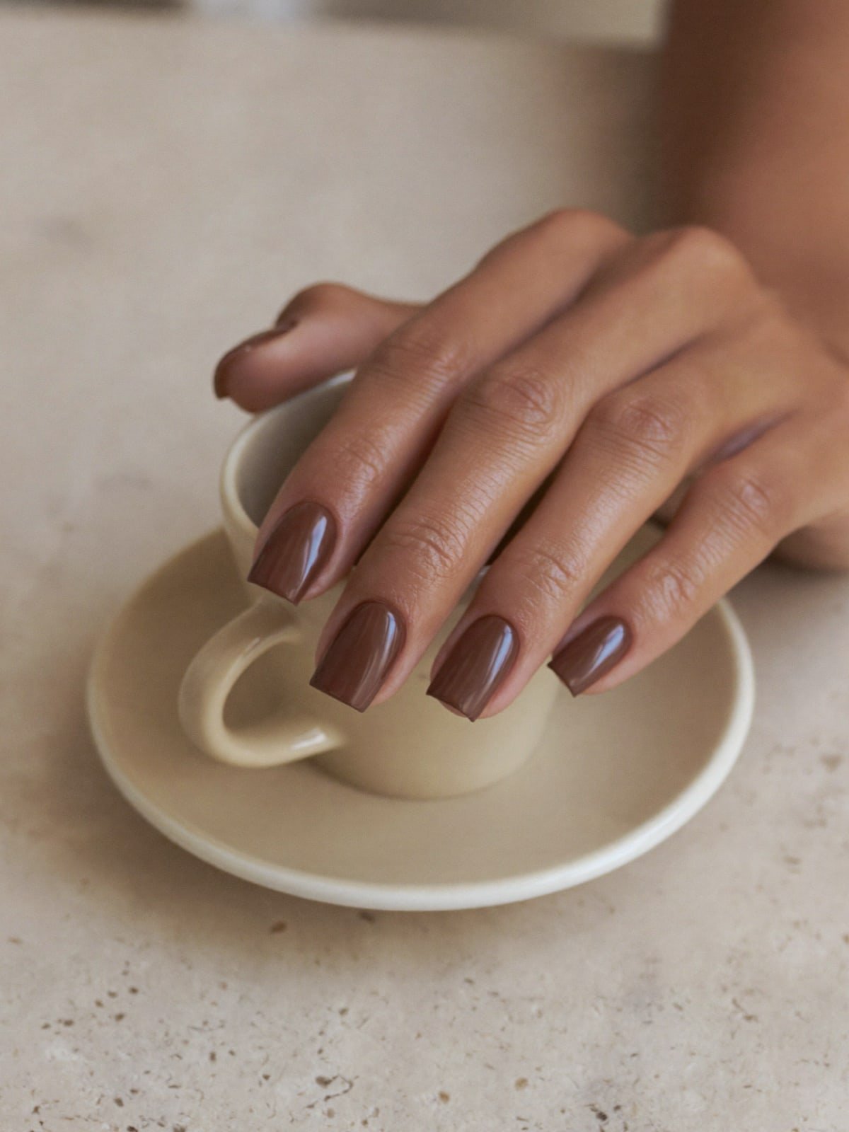 Mocha Mousse press-on nails worn on hand — Short square · Milky mocha